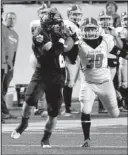  ?? Special to the Democrat-Gazette/JIMMY JONES ?? (left) makes a catch in front of Glen Rose’s Blake Nesbitt on a 70-yard touchdown pass that gave Charleston a 35-0 lead in the second quarter.