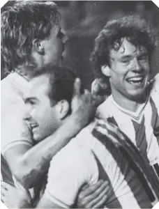  ??  ?? Colin West celebrates with Clive Walker (front) and Steve Berry (right)