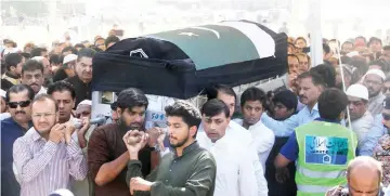  ??  ?? Relatives and residents carry the coffin of Sabika Sheikh following her body’s arrival from the US, in Karachi. — AFP photo