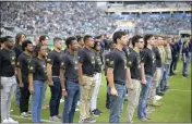  ?? PHELAN M. EBENHACK — THE ASSOCIATED PRESS FILE ?? Military recruits are sworn in during halftime on Salute to Service military appreciati­on day at an NFL football game between the Jacksonvil­le Jaguars and the Las Vegas Raiders on Nov. 6 in Jacksonvil­le, Fla.