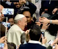  ?? AFP ?? Pope Francis greets people as he arrives for his general audience at the Paul VI Audience Hall at the Vatican. —