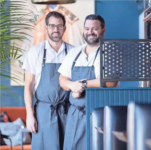  ?? MAX GERSH/THE COMMERCIAL APPEAL ?? Chefs Andy Ticer (left) and Michael Hudman are at the helm of Bishop.