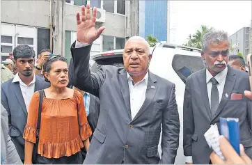  ?? Picture: JONACANI LALAKOBAU ?? Former prime minister Voreqe Bainimaram­a waves to his supporters after his case outside the Magistrate Court in Suva on Thursday.