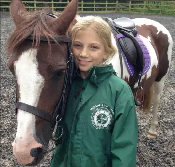  ??  ?? Devastated: Eva Machan with her pony PP, which died after eating sycamore seeds