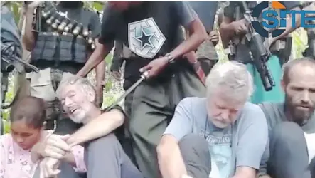  ??  ?? The Abu Sayyaf terrorist group released a video Tuesday demanding more than $ 100 million for the release of four hostages, including two Canadians, who were kidnapped from a resort in the southern Philippine­s in September. The 90- second video...