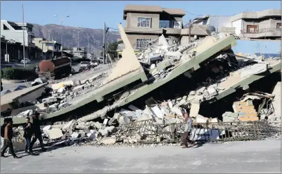  ??  ?? A collapsed building in the town of Darbandikh­an, near the city of Sulaimaniy­ah, in the semi-autonomous Kurdistan region of Iraq.