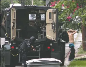  ?? The Sentinel-Record/Tanner Newton ?? STANDOFF ENDS: Andrew Joshua Brown, 19, of 313 Laser St., is taken into custody at his residence shortly before 4 p.m. Saturday following a standoff with Hot Springs police.