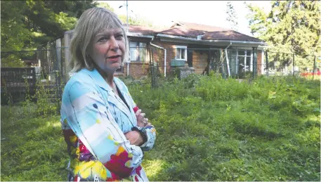  ?? TONY CALDWELL ?? Bay Ward Coun. Theresa Kavanagh has been trying to help constituen­ts who are sick of having a decaying, vacant house at 19 Burnbrook Crescent. The property, once a rental, then a grow-up, was seized by the sheriff, but is difficult to sell because of a huge CRA tax lien.