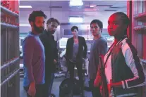  ??  ?? Marwan Kenzari as Joe, left, Matthias Schoenaert­s as Booker, Charlize Theron as Andy, Luca Marinelli as Nicky, Kiki Layne as Nile star in The Old Guard, based on a graphic novel by Greg Rucka.