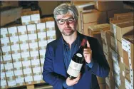  ?? FABRICE COFFRINI / AFP ?? A 1.5-liter bottle of Vosne-Romanee 1er cru Cros Parantoux wine by late winemaker Henri Jayer is on display on April 27.