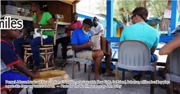  ?? — Photo for The Washington Post by John Briley ?? Pompei Johnson breaks out his accordion at Sunshine, a restaurant in New Bight, Cat Island, Bahamas, while a local boy plays a goat-skin drum and tourists look on.