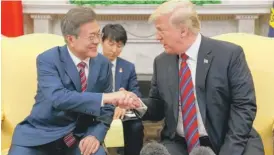  ?? EVANVUCCI/ AP ?? President Donald Trump meets with South Korean President Moon Jae- In in the Oval Office on May 22.