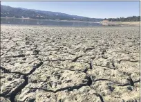  ?? HAVEN DALEY — THE ASSOCIATED PRESS ?? An exposed dry bed is seen at Lake Mendocino near Ukiah, Calif. on Aug. 4, 2021.