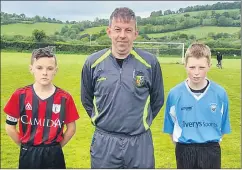  ?? ?? Kilworth Celtic captain Killian Ball, referee Stephen Pratt and captain of Cappoquin/Railway FC Cathal Hogan, prior to their cup final on Saturday last.