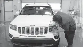  ?? MIKE HOUSEHOLDE­R AP ?? Prices subsided in January as fewer expensive new and used luxury vehicles were sold.