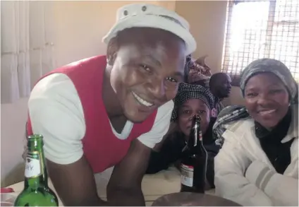  ?? MATTHEW FISHER/ POSTMEDIA NEWS ?? William Maso, left, who has a job, and Phumla Singeni, right, who doesn’t, believe the already grim economic situation of black South Africans is about to get worse. The two are regulars at Dodo’s Tavern, a shebeen in the Johannesbu­rg suburb of Soweto.