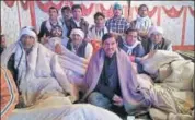  ?? HT PHOTO ?? Congress’ Sapotra candidate and incumbent MLA Ramesh Chand Meena with his supporters outside a strong room on Sunday.