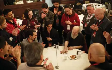  ?? COLE BURSTON FOR THE TORONTO STAR ?? Magician Eugene Burger performs a card trick during the lunch break at Browser’s Magic Bash, the annual event put on by Jeff Pinsky.