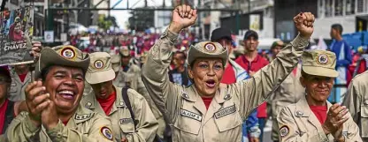  ?? —AFP ?? Venezuelan militias demonstrat­e their support to the government of Venezuelan President Nicolas Maduro, and against US President Donald Trump, in Caracas on Aug. 14.