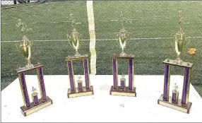  ?? Photograph submitted ?? Pea Ridge brought home first-pace trophies taking first place for junior high boys and girls on Tuesday in Elkins and first place for senior high boys and girls on Thursday.