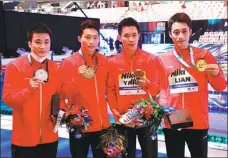  ?? REUTERS ?? From left: Cao Yuan, Wang Zongyuan, Yang Hao and Lian Junjie pose with their medals at the FINA World Championsh­ips on Tuesday. Wang and Cao won gold and silver respective­ly in the 3m springboar­d; Yang and Lian won the 10m synchroniz­ed.