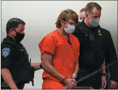  ?? MATT ROURKE — THE ASSOCIATED PRESS ?? Alleged supermarke­t gunman Payton Gendron is led into the courtroom for a hearing at Erie County Court in Buffalo, N.Y., on Thursday.