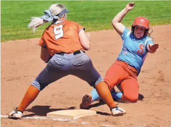  ?? JIM THOMPSON/JOURNAL ?? Victoria Reyes of Sandia slides into third base to beat the tag by Eldorado’s Ashley Mills on Saturday.