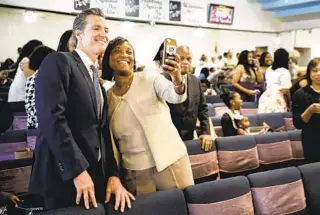  ?? JAY L. CLENDENIN TNS ?? Then-Lt. Gov Gavin Newsom takes a selfie with SEIU official Laphonza Butler in 2018 in Compton. This week, Gov. Newsom named Butler to fill the vacancy left by Sen. Dianne Feinstein’s death.