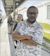  ?? Mike Schneider The Associated Press ?? Jishnu Mukdrji and Penny Jacobs wait to board an Amtrak train in Orlando, Fla. The pair met and became friends through an online train forum.