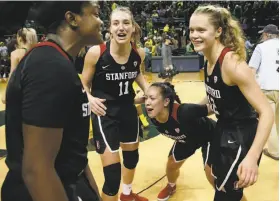  ?? Chris Pietsch / Associated Press ?? Stanford's Nadia Fingall (left), Alanna Smith and Marta Sniezek celebrate with teammate Brittany McPhee (12), who scored the Cardinal’s final 19 points.