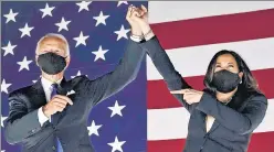  ?? AFP ?? Democratic presidenti­al candidate Joe Biden (left) and his running mate for the vice-presidency, n
Kamala Harris, gesture towards supporters at Chase Center in Wilmington, Delaware.