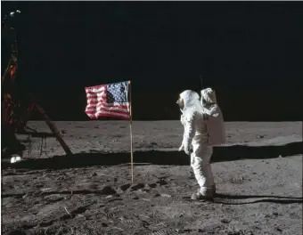  ?? APFILE ?? TO INFINITY AND BEYOND: Astronaut Buzz Aldrin Jr. poses for a photograph beside the U.S. flag on the moon during the Apollo 11 mission on July 20, 1969.