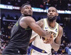  ?? STEPHEN LEW/ USA TODAY SPORTS ?? LeBron James and the Lakers will face off against Zion Williamson, left, and the Pelicans in the play-in tournament Tuesday in New Orleans.