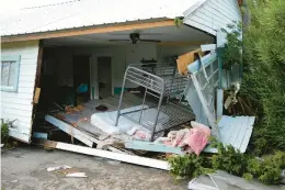  ?? REBECCA BLACKWELL/AP ?? A home in Horseshoe Beach, Fla., was swept from its lot and broken open during Hurricane Idalia last year.