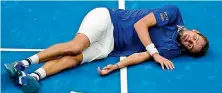  ?? ?? After winning the match, Medvedev dropped to the floor, playing dead.