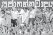  ?? REUTERS ?? ▪ Ranil Wickremesi­nghe (3rd left) waves at his supporters.