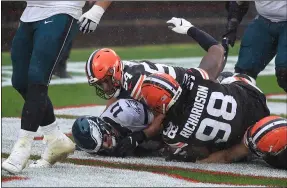  ?? TIM PHILLIS — FOR THE MORNING JOURNAL ?? Olivier Vernon and Sheldon Richardson sack Eagles QB Carson Wentz for a safety during the Browns’ 22-17 win on Nov. 22.
