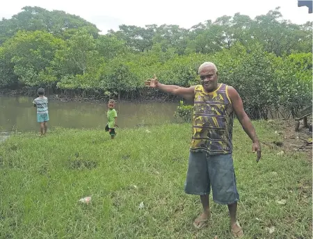 ?? Photo: Shahani Mala ?? Isikeli Vuniwaqa of Namata Village points to the river that now floods in rain not just cyclones.