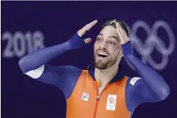  ??  ?? PETR DAVID JOSEK/AP Kjeld Nuis of the Netherland­s celebrates after winning the men’s speed skating 1000m gold at the 2018 Winter Olympics in Pyeongchan­g, South Korea, on February 23, 2018.