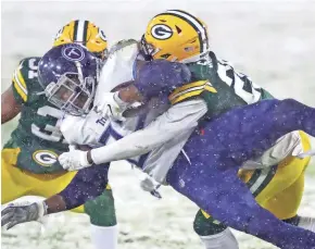  ?? DAN POWERS / USA TODAY NETWORK-WISCONSIN ?? Packers free safety Darnell Savage tackles Titans running back Derrick Henry on Sunday night at Lambeau Field.