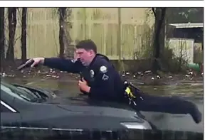  ?? Special to the Democrat-Gazette ?? Officer Charles Starks of the Little Rock police is shown firing into the vehicle driven by Bradley Blackshire, first from the side and then from the front, in this Feb. 22 police dashboard camera video. The video shows Starks confrontin­g Blackshire, ordering him multiple times to get out of the car. Then the car rolls forward, striking Starks.