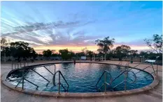  ??  ?? From top: Visitors can enjoy breathtaki­ng panoramas and spectacula­r sunsets in the Warrumbung­le National Park; welcome to the historic mining town of Lightning Ridge, where natural thermal waters reward weary travellers.