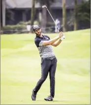  ?? The Island Packet via AP SCOTT SCHROEDER photo ?? Dustin Johnson hits from the eighth fairway during the second round of the RBC Heritage on Friday.