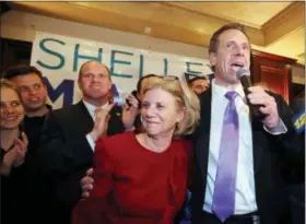  ?? SETH HARRISON—ASSOCIATED PRESS ?? In this Tuesday, April 24, 2018 photo, Shelley Mayer, center, is congratula­ted by Gov. Andrew Cuomo in a Mamaroneck, N.Y., restaurant after she defeated Republican Julie Killian in the race for the New York State Senate’s 37th District.