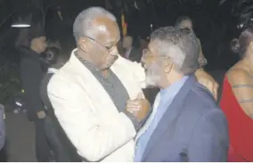  ??  ?? Action Chemical &amp; Equipment Managing Director Clement Bernard (left) embraced retired businessma­n George ‘King George’ Jograj.