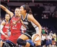  ?? Bruce Kluckhohn / Associated Press ?? Minnesota Lynx forward Napheesa Collier drives to the basket during the first quarter against the Washington Mystics in September.