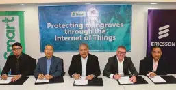  ??  ?? Smart and Ericsson officials sign a memorandum of understand­ing for the Connected Mangroves project in the Philippine­s. Signing the MOUare Smart VP/Head of Technical Operations Center Pierre de los Reyes, PLDTSmart Public Affairs Head Ramon Isberto,...