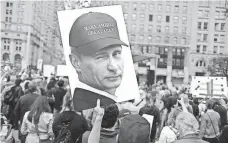  ?? EDUARDO MUNOZ ALVAREZ, GETTY IMAGES ?? Demonstrat­ion in New York last month. President Trump is scheduled to meet with Russian President Putin today.