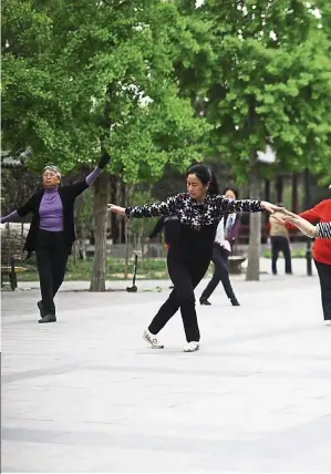  ?? — AFP ?? Filepic of a group of women dancing at a park in Beijing.