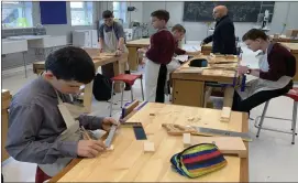  ??  ?? Pupils at Scoil Mhuire, Béal Átha’n Ghaorthaid­h, learning their trade in the school’s new woodwork room.